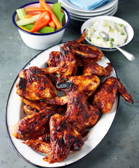 Sticky bourbon American BBQ wings with blue cheese dip