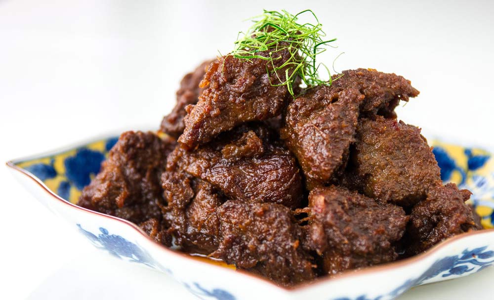 Beef rendang with herby rice