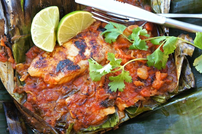 Whole fish cooked in a banana leaf with mango chutney