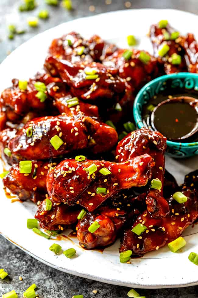 Crispy baked chicken wings with Korean barbecue and buffalo sauce