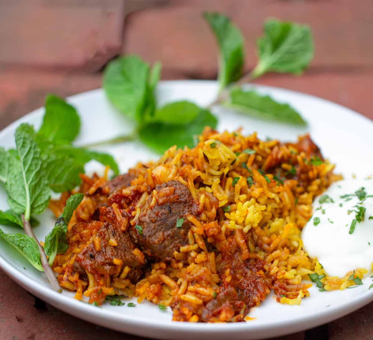 Aubergine biryani with cucumber and mint raita